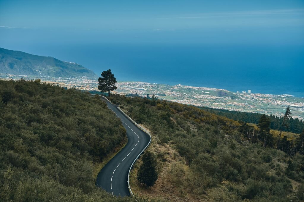 Scenic mountain road in Spain with ocean views, showing driving in Spain with a US License