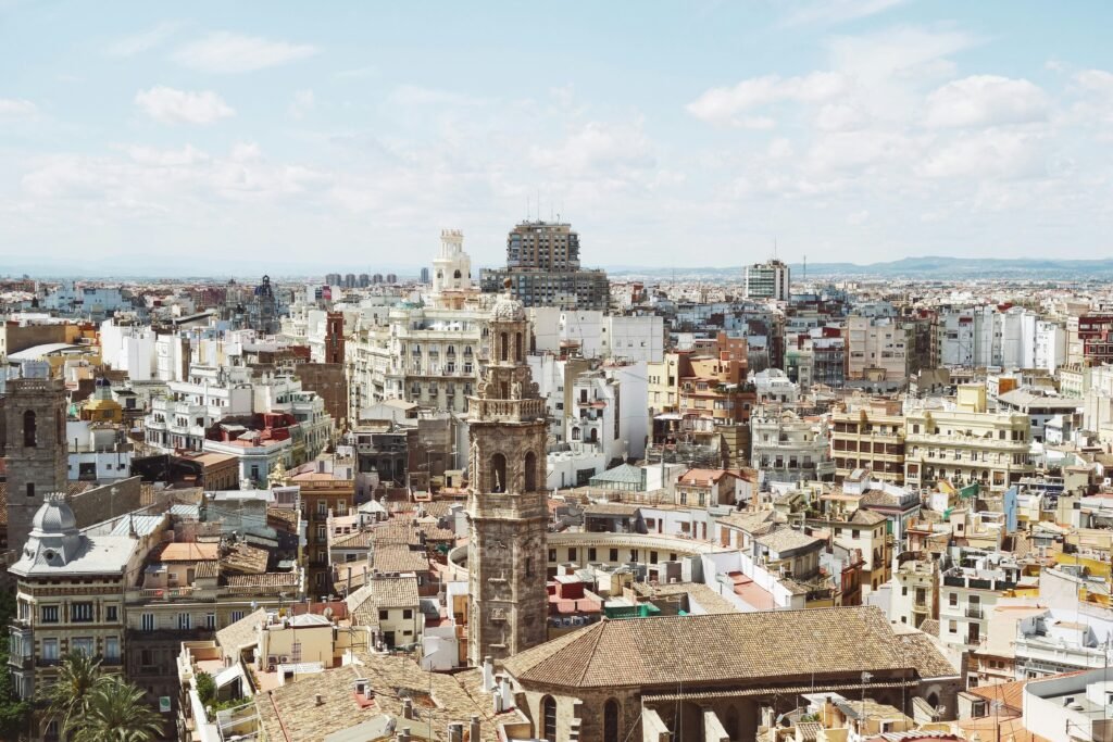 A scenic view of Valencia’s coastline, featuring Playa de la Malvarrosa, golden sands, and the lively beachfront promenade, making it a top seaside city in Spain.