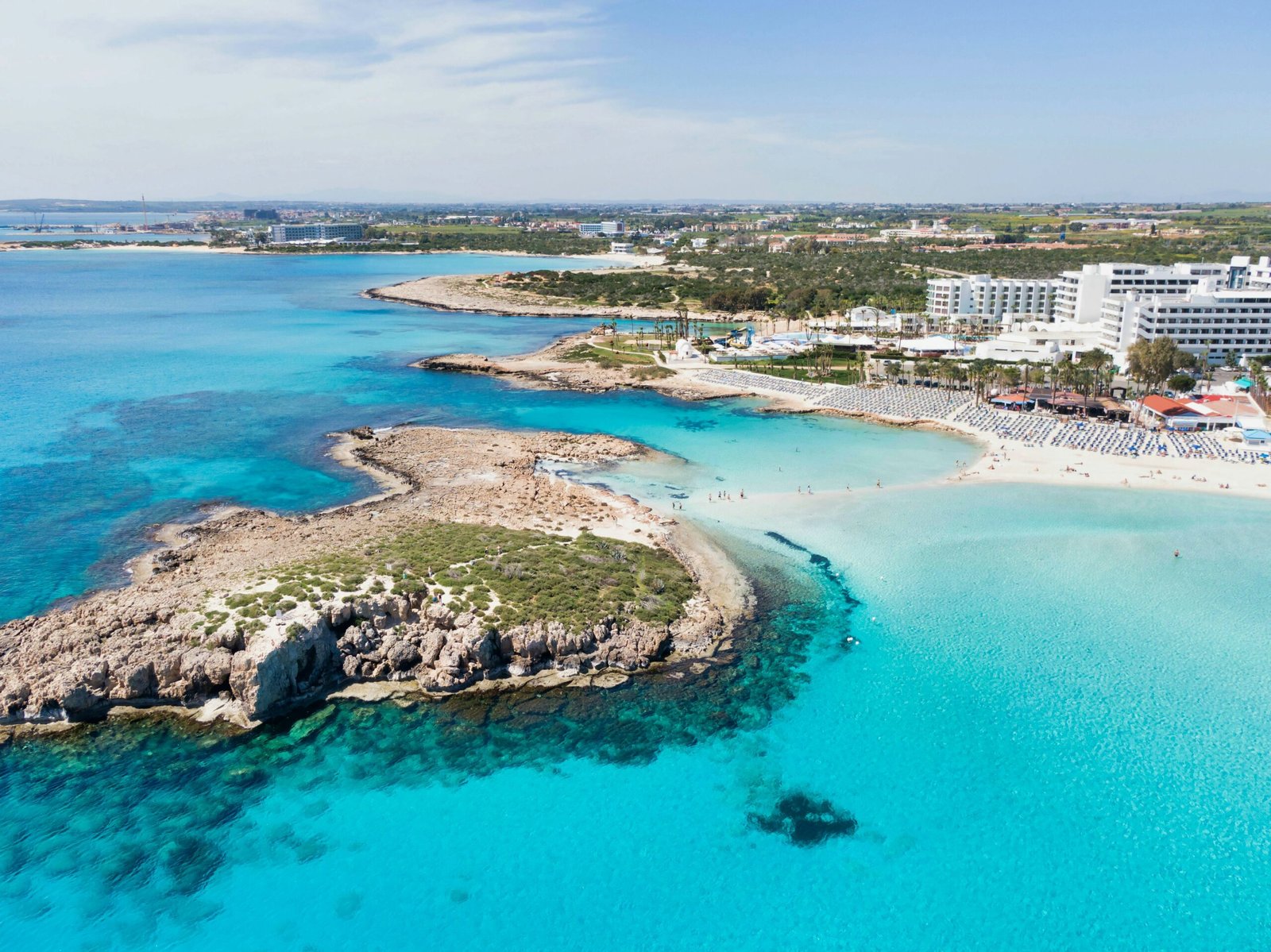 Stunning turquoise waters and sandy beaches in Cyprus, one of the easiest European countries to move to.