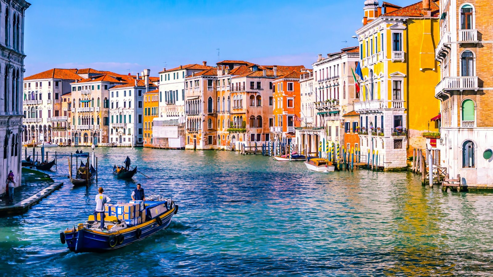 Colorful buildings lining the Grand Canal in Venice, Italy, a popular choice among the easiest European countries to move to.